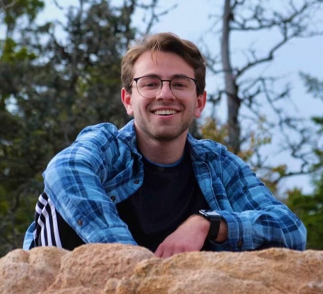 Jonah sitting on a rock